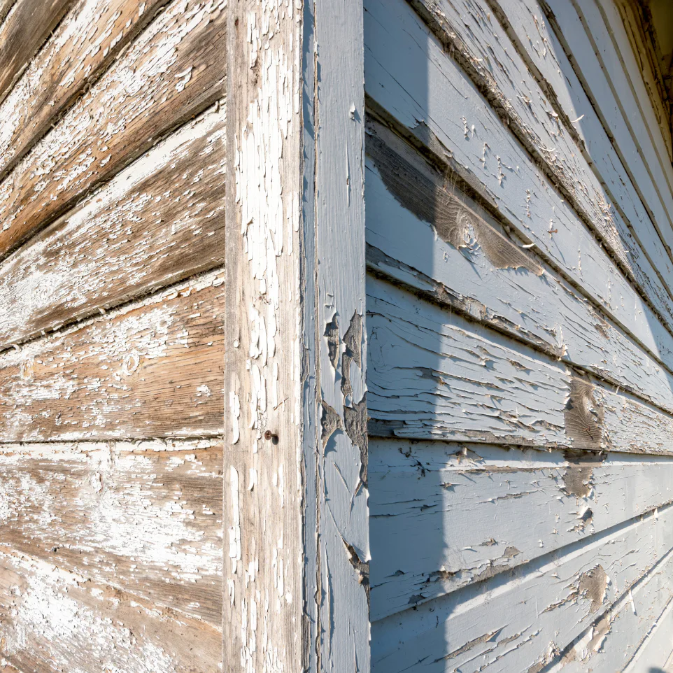 a cracked lead paint on a wooden house