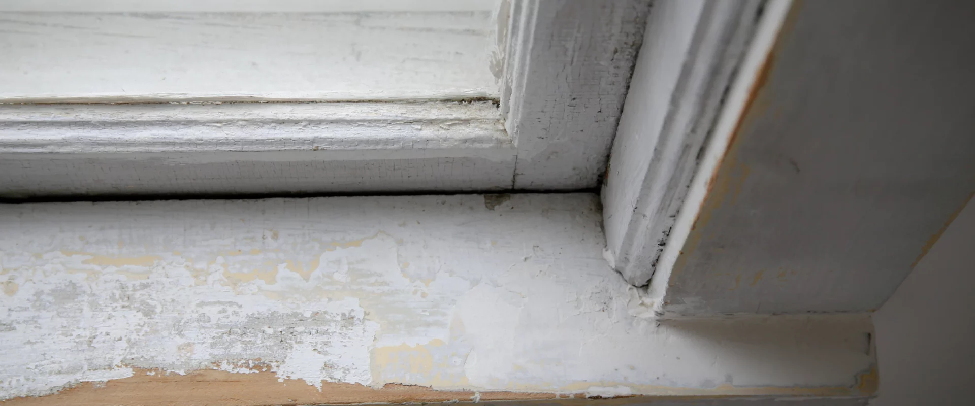 a deteriorated lead paint on the window sill